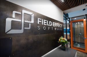 Image of welcoming area of Field Effect's office, with display of their logo