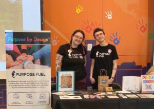 Founder of Purpose Fuel Jesse Pyne stands with Sarah Ricciardelli at Open Doors Ottawa as they showcase the digital services available from Purpose Fuel 