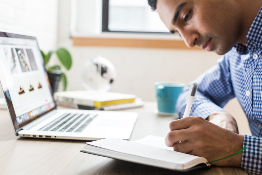 Man taking notes at a desk