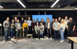 A group of representatives from ten startup companies from the National Capital Region and hosts gather for a group picture.