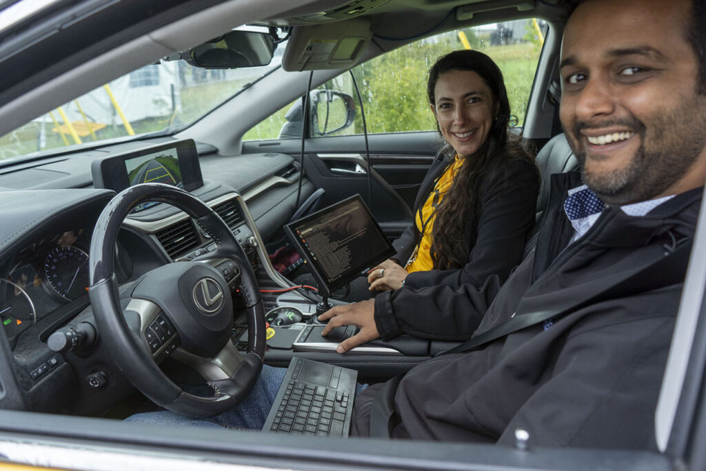 Two people sitting inside a vehicle
