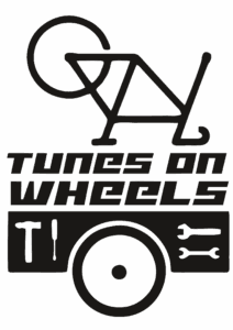A logo reading Tunes on Wheels that shows a bike flipped upside down 