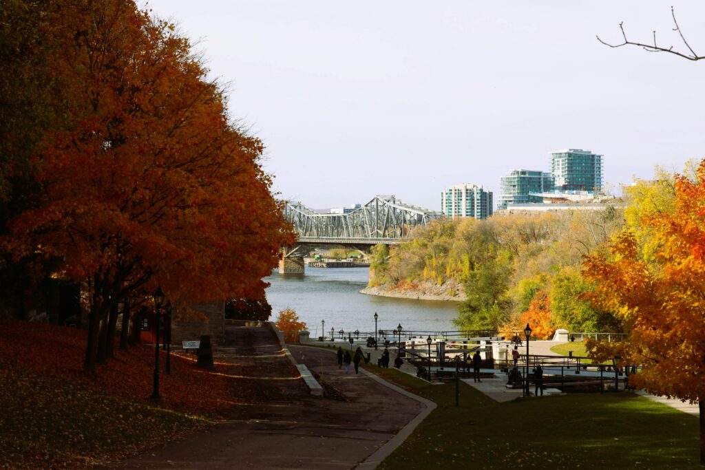 An image of the Ottawa skyline at dusk, overlooking the Pariliament buildings and the National Arts Centre
