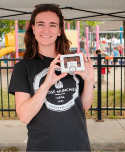 Founder of Moose Munchies, Gillian Manton, holding a box of her fudge treat. 