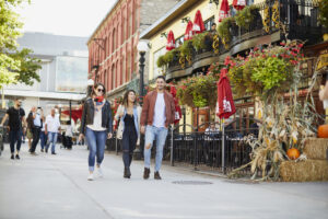 Three people walk down William Street in the ByWard Market in Ottawa