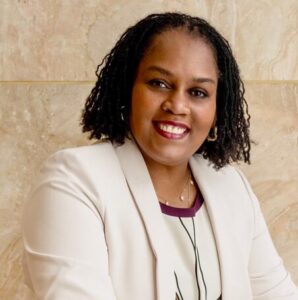 A profile image of Diane Watson, smiling, and quarter turned towards the camera. 