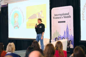 Emily O'Brien, Owner and Founder of Comeback Snacks takes the stage at International Women's Month 2026. 