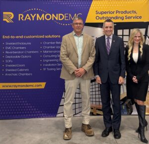 President of Raymond EMC Bruce Alexander stands with Mayor of Ottawa Marc Sutcliffe, and Invest Ottawa President and CEO Sonya Shorey