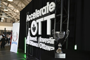 The stage at AccelerateOTT, with the trophy for the competition in the foreground.