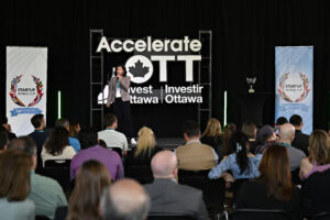 The stage at AccelerateOTT 2025, a view of the stage from behind the audience.