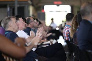 An audience shot from AccelerateOTT 2025, a view of the audience applauding from the side.